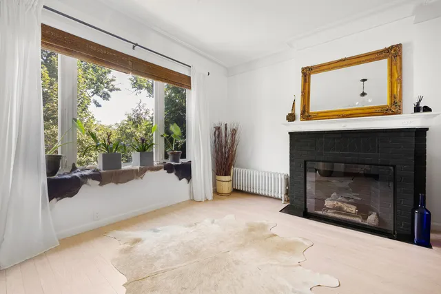 a view of a livingroom with furniture and a fireplace