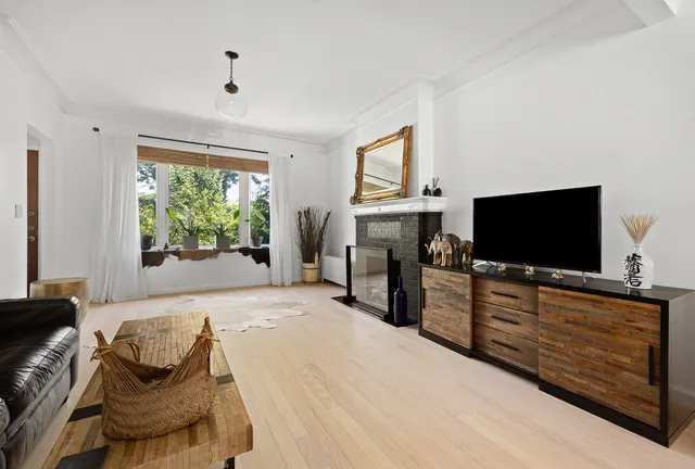 a bedroom with furniture and a flat screen tv