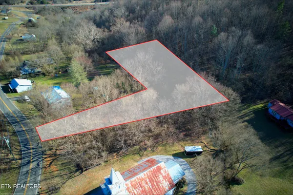 an aerial view of residential house with outdoor space
