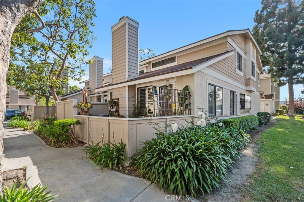 12700 Fallbrook Way Stanton, CA 92841 - Photo 1 of 31 a front view of a house with garden