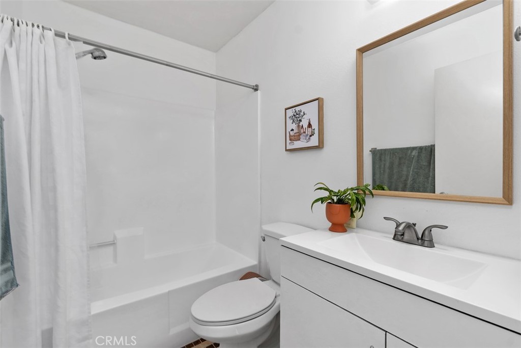 12700 Fallbrook Way Stanton, CA 92841 - Photo 18 of 31 a bathroom with a sink a toilet and shower