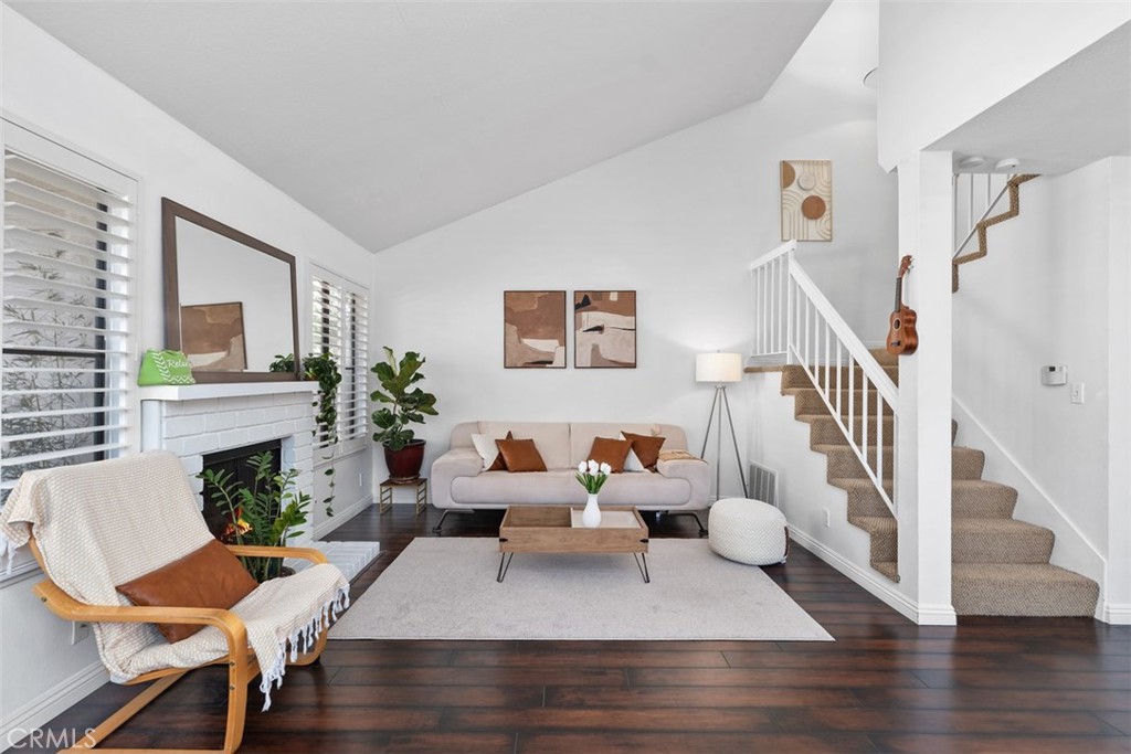 12700 Fallbrook Way Stanton, CA 92841 - Photo 5 of 31 a living room with furniture and a fireplace