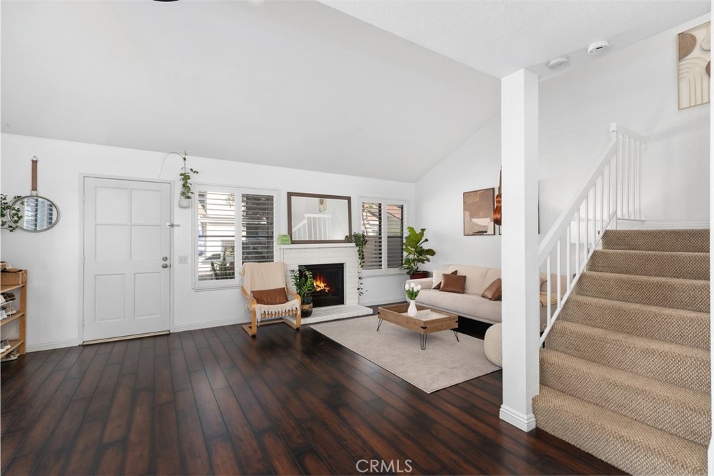 12700 Fallbrook Way Stanton, CA 92841 - Photo 9 of 31 a living room with furniture and a fireplace