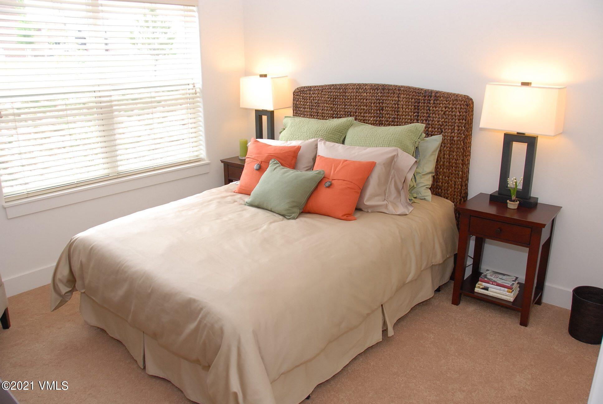 80 Freestone Road, Unit C101 Eagle, CO 81631 - Photo 12 of 14 a bedroom with a bed and a lamp