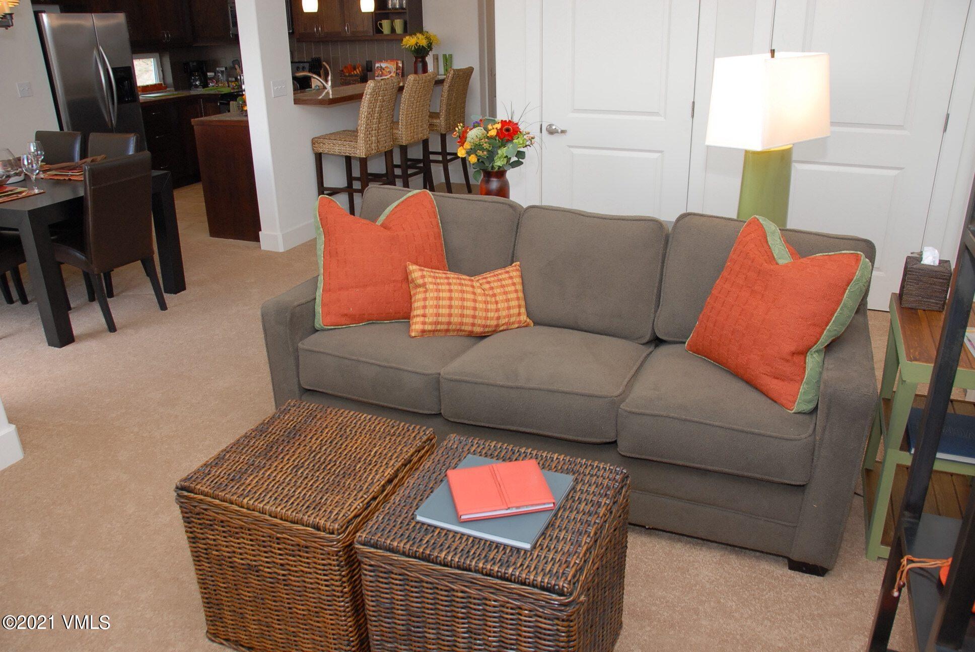 80 Freestone Road, Unit C101 Eagle, CO 81631 - Photo 2 of 14 a living room with furniture and a lamp