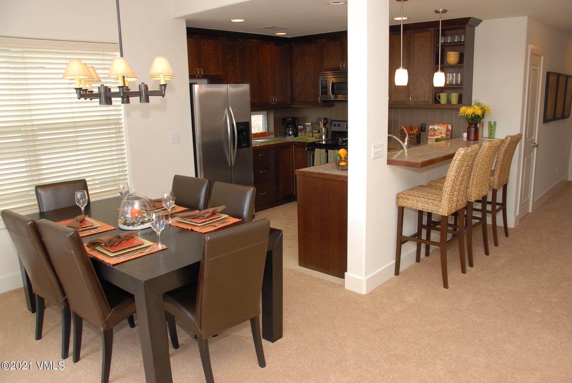 80 Freestone Road, Unit C101 Eagle, CO 81631 - Photo 5 of 14 a view of a dining room with furniture