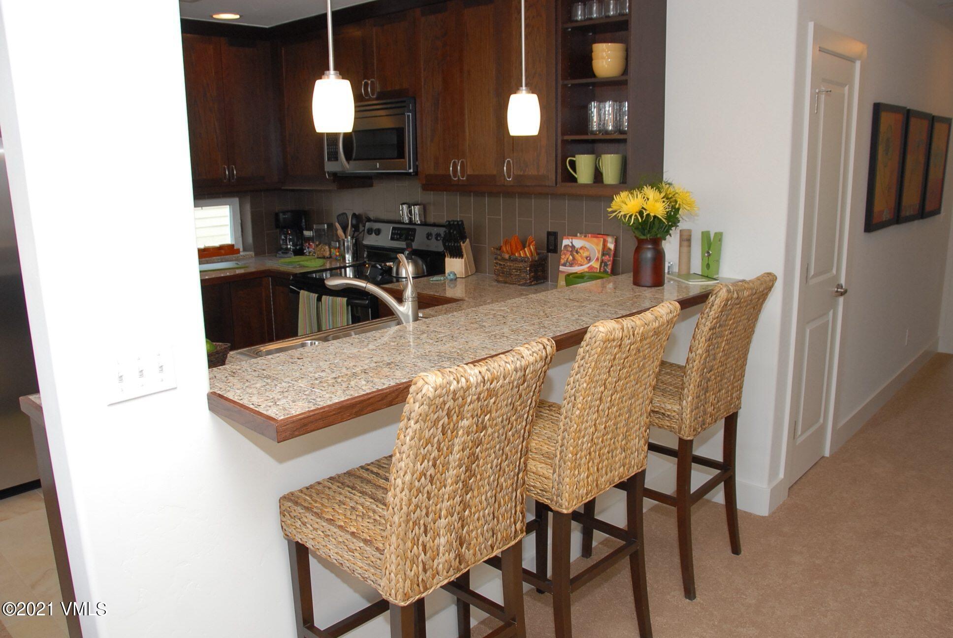 80 Freestone Road, Unit C101 Eagle, CO 81631 - Photo 6 of 14 a view of a dining room with furniture