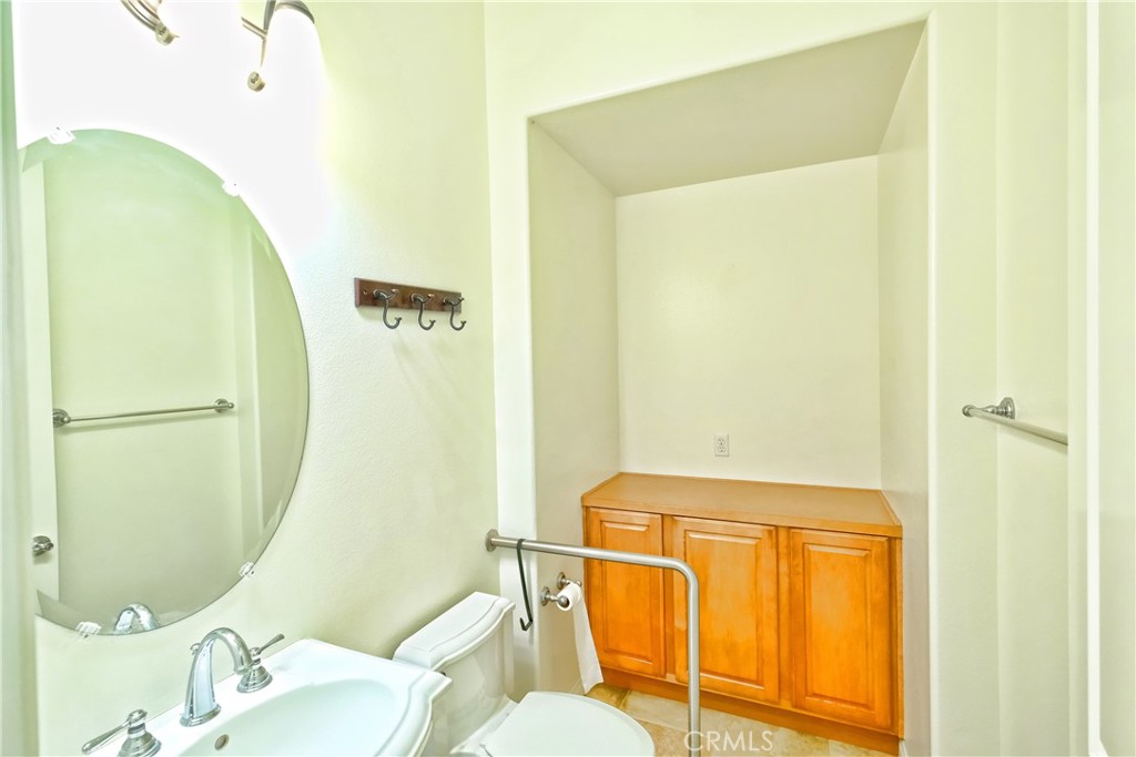 1791 Hannon Road Cherry Valley, CA 92223 - Photo 12 of 41 a bathroom with a sink and a mirror