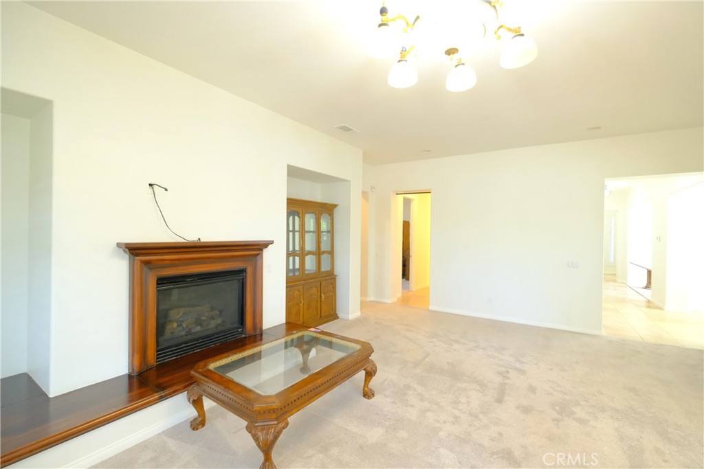 1791 Hannon Road Cherry Valley, CA 92223 - Photo 17 of 41 a living room with furniture and a fireplace