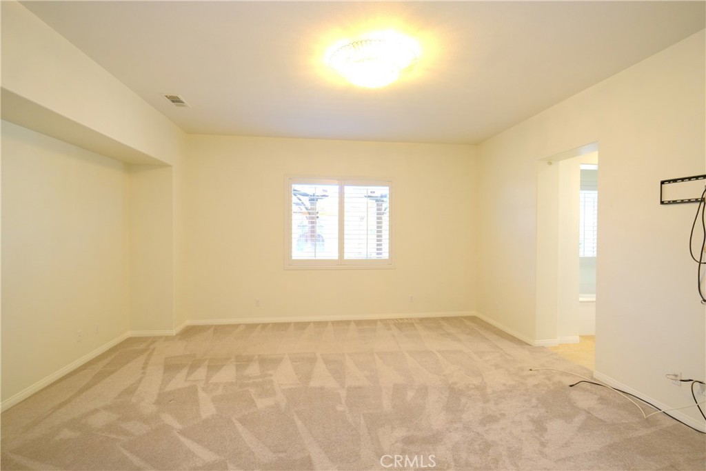 1791 Hannon Road Cherry Valley, CA 92223 - Photo 19 of 41 a view of an empty room with a window