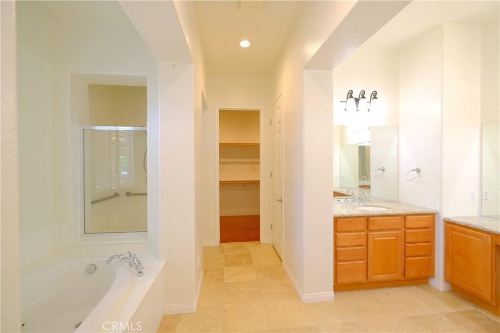 1791 Hannon Road Cherry Valley, CA 92223 - Photo 20 of 41 a bathroom with a tub sink and mirror