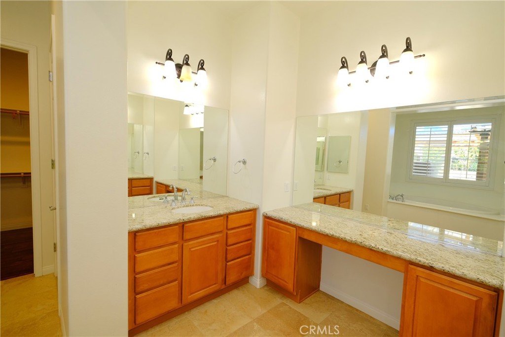 1791 Hannon Road Cherry Valley, CA 92223 - Photo 22 of 41 a bathroom with a granite countertop sink mirror and double