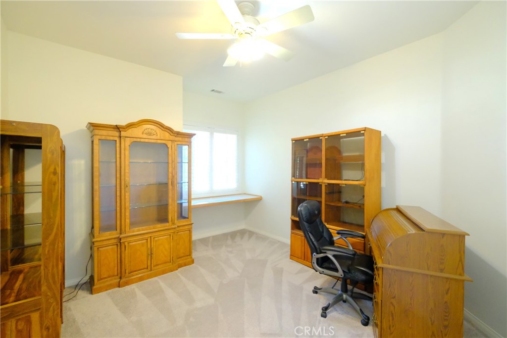 1791 Hannon Road Cherry Valley, CA 92223 - Photo 25 of 41 a view of a workspace with furniture and a window
