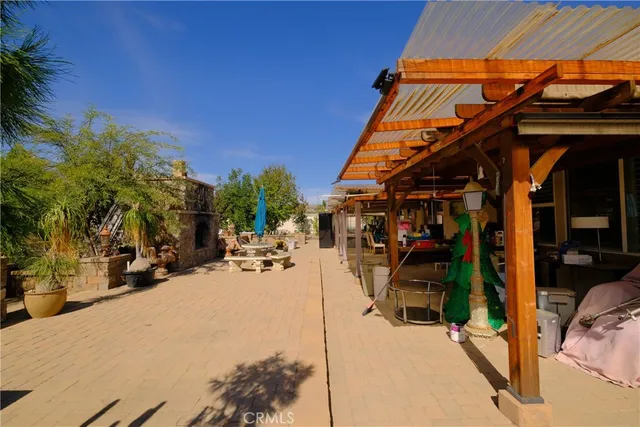 a view of a patio with swimming pool
