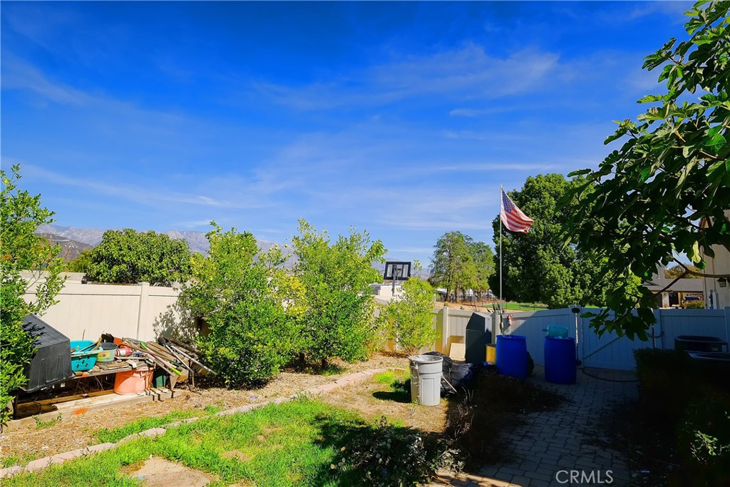 1791 Hannon Road Cherry Valley, CA 92223 - Photo 34 of 41 a view of a garden with plants and a bench