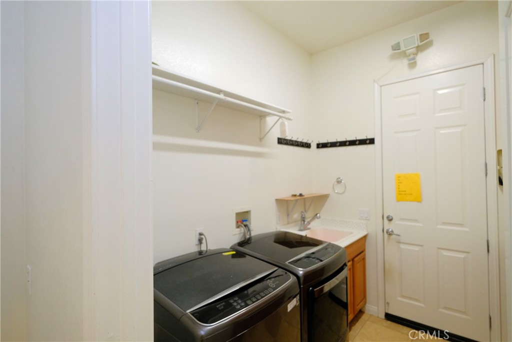 1791 Hannon Road Cherry Valley, CA 92223 - Photo 40 of 41 a utility room with dryer and washer