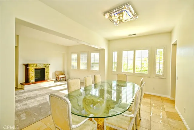 a bedroom with a couch and a window