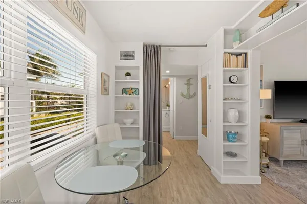 a bathroom with a bathtub and a mirror