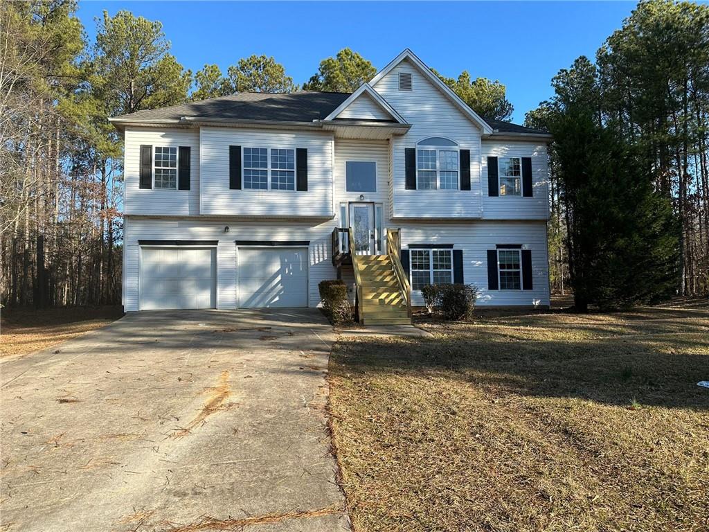 a view of a brick house with a yard