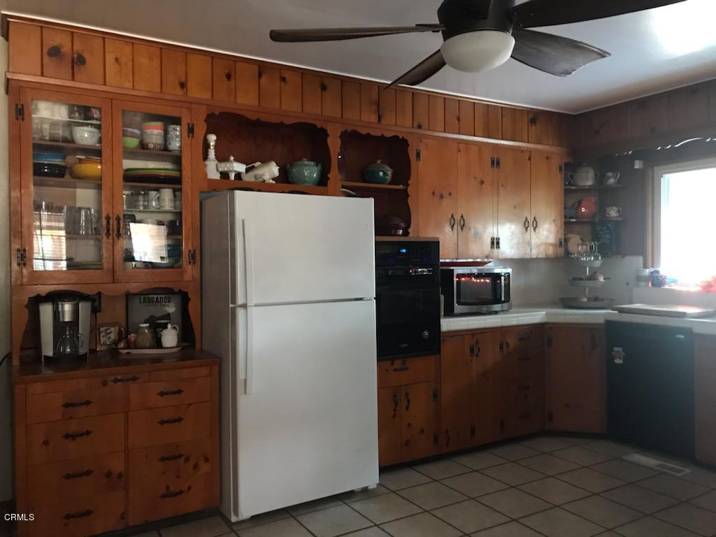 339 South Reed Avenue Reedley, CA 93654 - Photo 2 of 16 a kitchen with stainless steel appliances granite countertop a refrigerator and a sink