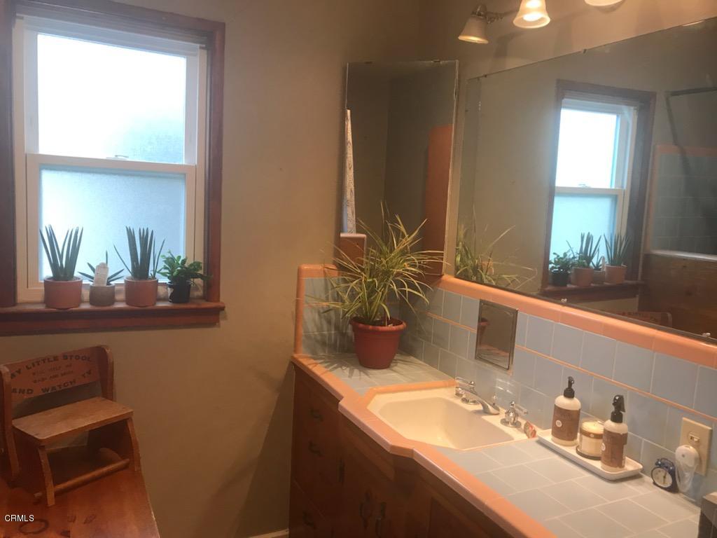 339 South Reed Avenue Reedley, CA 93654 - Photo 7 of 16 a bathroom with a sink and a mirror