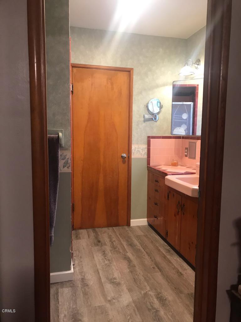 339 South Reed Avenue Reedley, CA 93654 - Photo 8 of 16 a bathroom with a granite countertop sink and a mirror