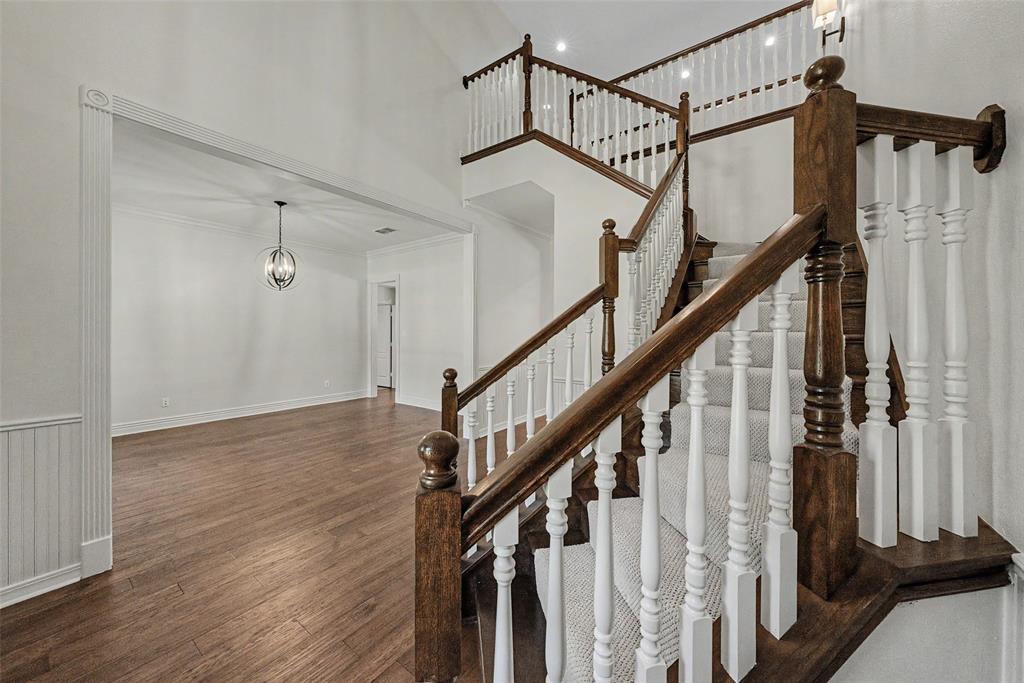 1200 Mount Gilead Road Keller, TX 76262 - Photo 7 of 38 a view of staircase with wooden floor and white walls