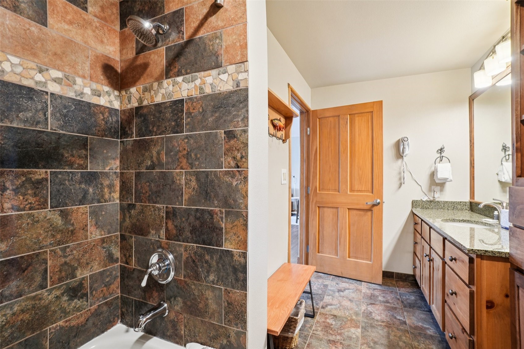 129 River Run Road, Unit 8055 Keystone, CO 80435 - Photo 16 of 50 Bathroom with vanity, shower / tub combination, and stone finish flooring