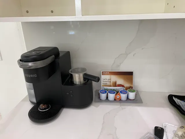 a bedroom with a bed and a television