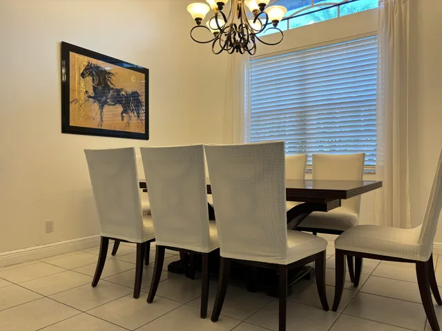 a bathroom with a sink a large mirror and a toilet
