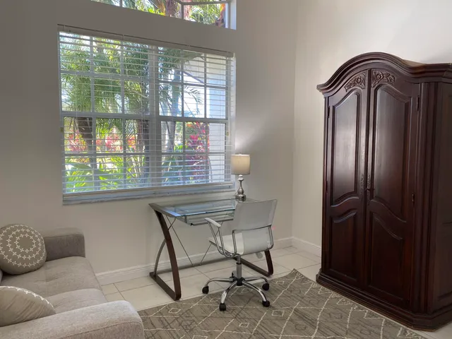 a bathroom with a sink a toilet a shower and a mirror