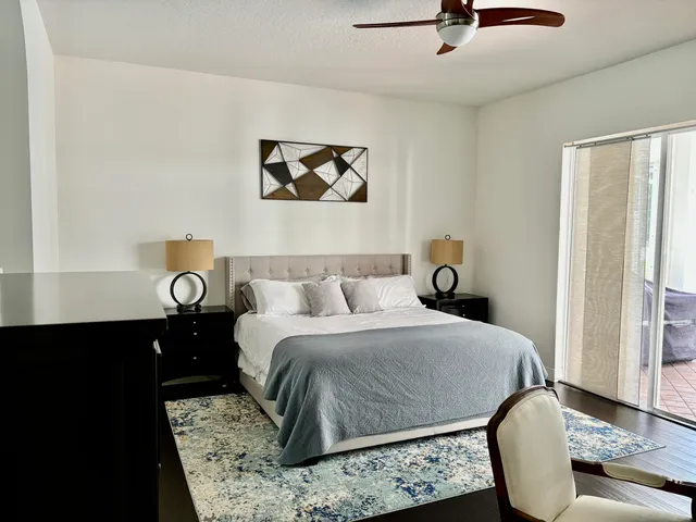 a bedroom with a bed and a tv