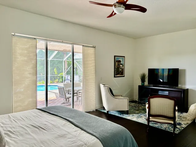 a bedroom with furniture and a window