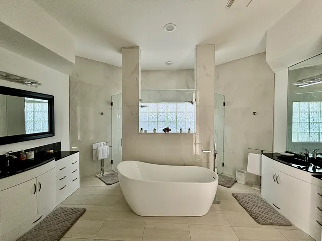 a porch with a glass door shower and yard