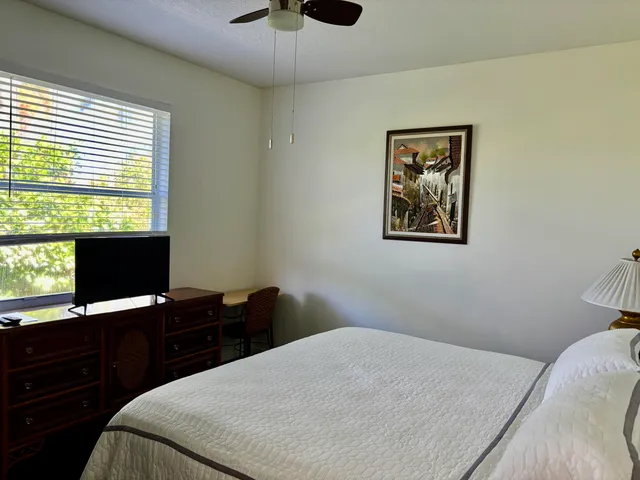 a view of a chairs and table in the patio