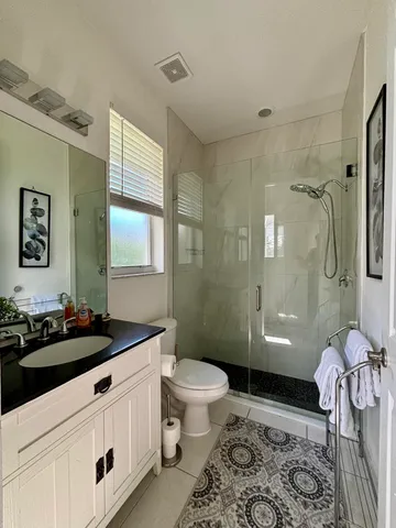 a view of a patio with a dining table and chairs