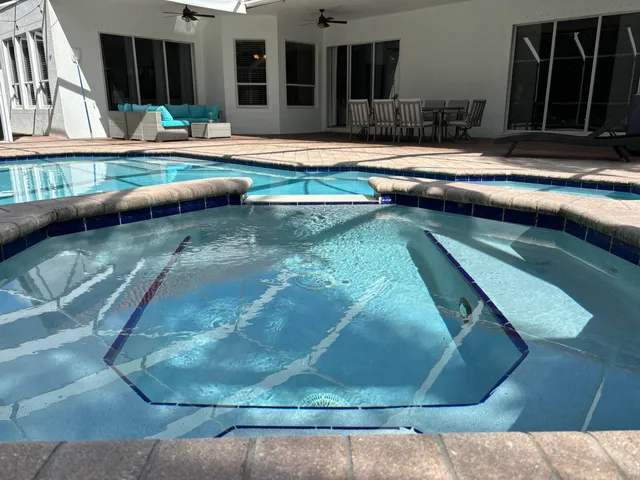 a bathroom with a mirror and a sink