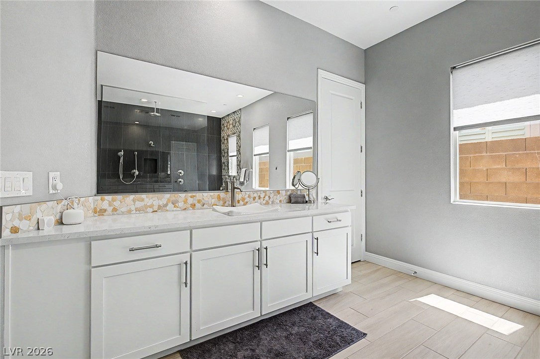 6014 Willow Ridge Court Las Vegas, NV 89135 - Photo 46 of 99 This spacious primary bathroom features a large vanity with ample storage and a walk-in shower.