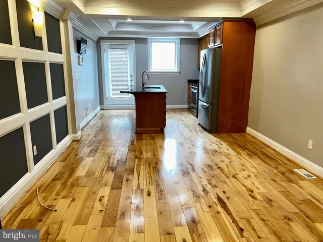 a view of kitchen with wooden floor and chair