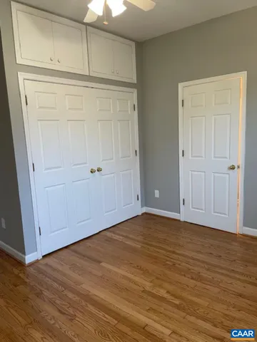 an empty room with wooden floor