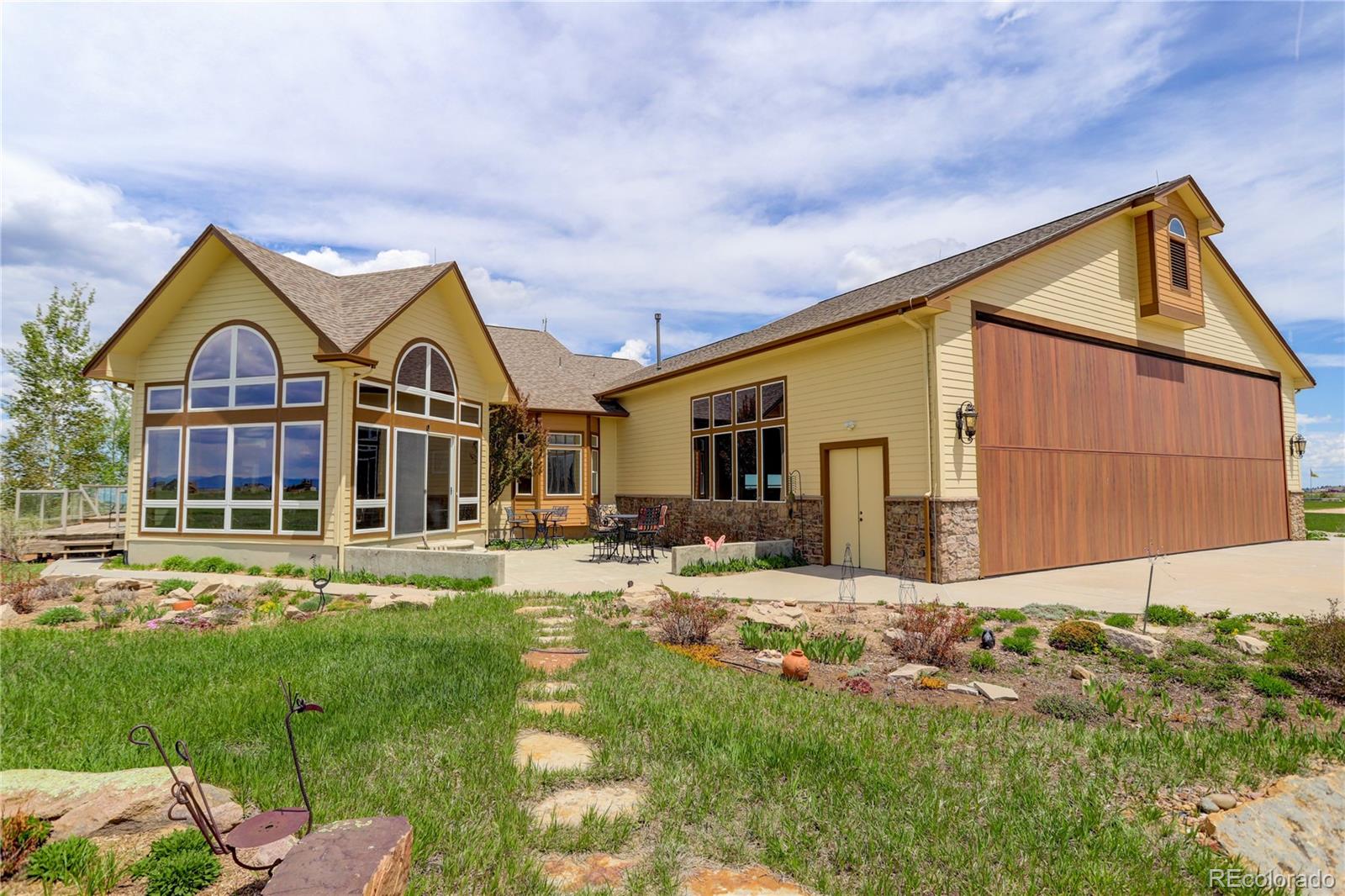 24943 Ben Kelly Road Elbert, CO 80106 - Photo 1 of 39 a front view of a house with a yard