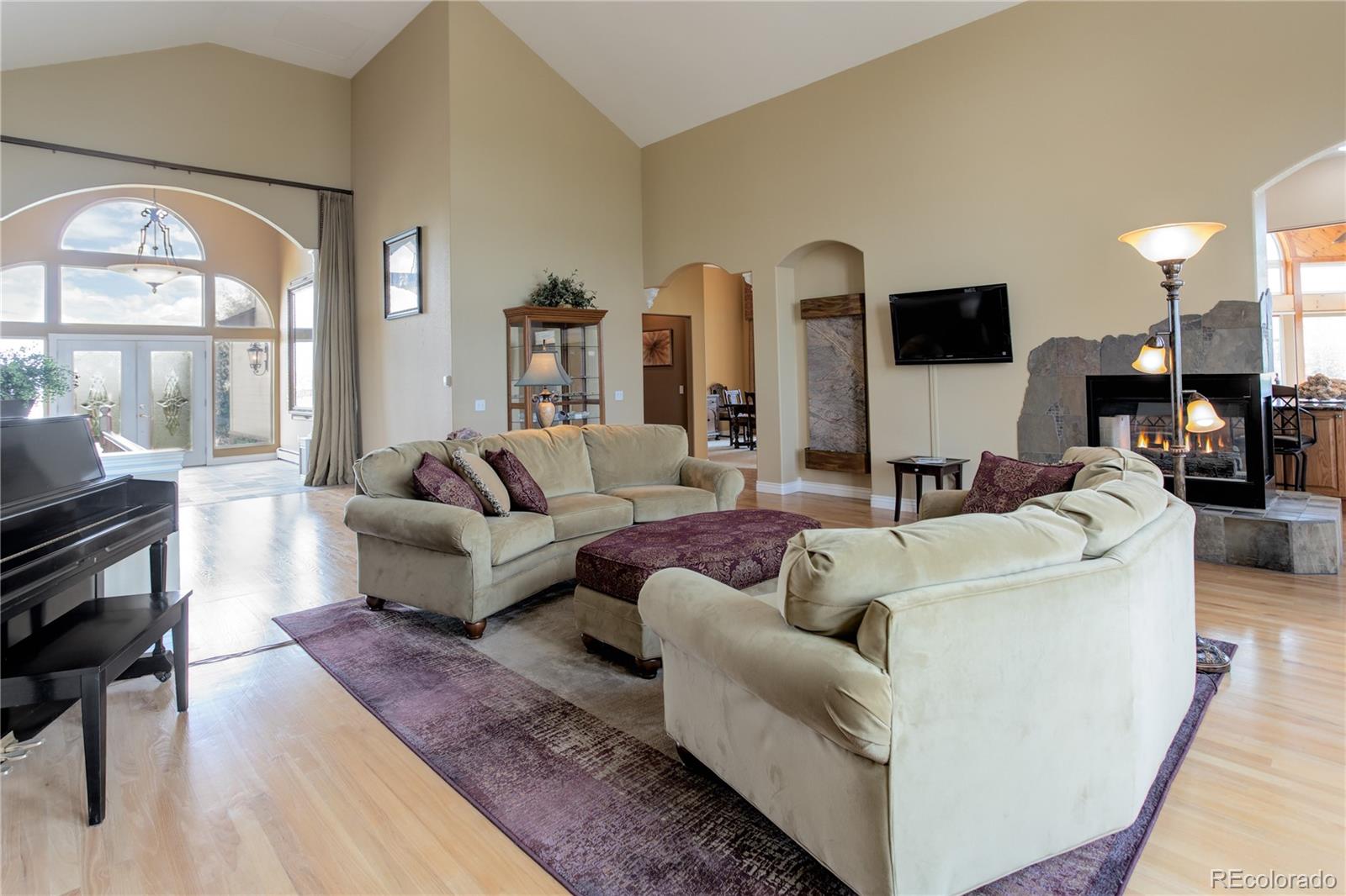 24943 Ben Kelly Road Elbert, CO 80106 - Photo 11 of 39 a living room with furniture and a large window