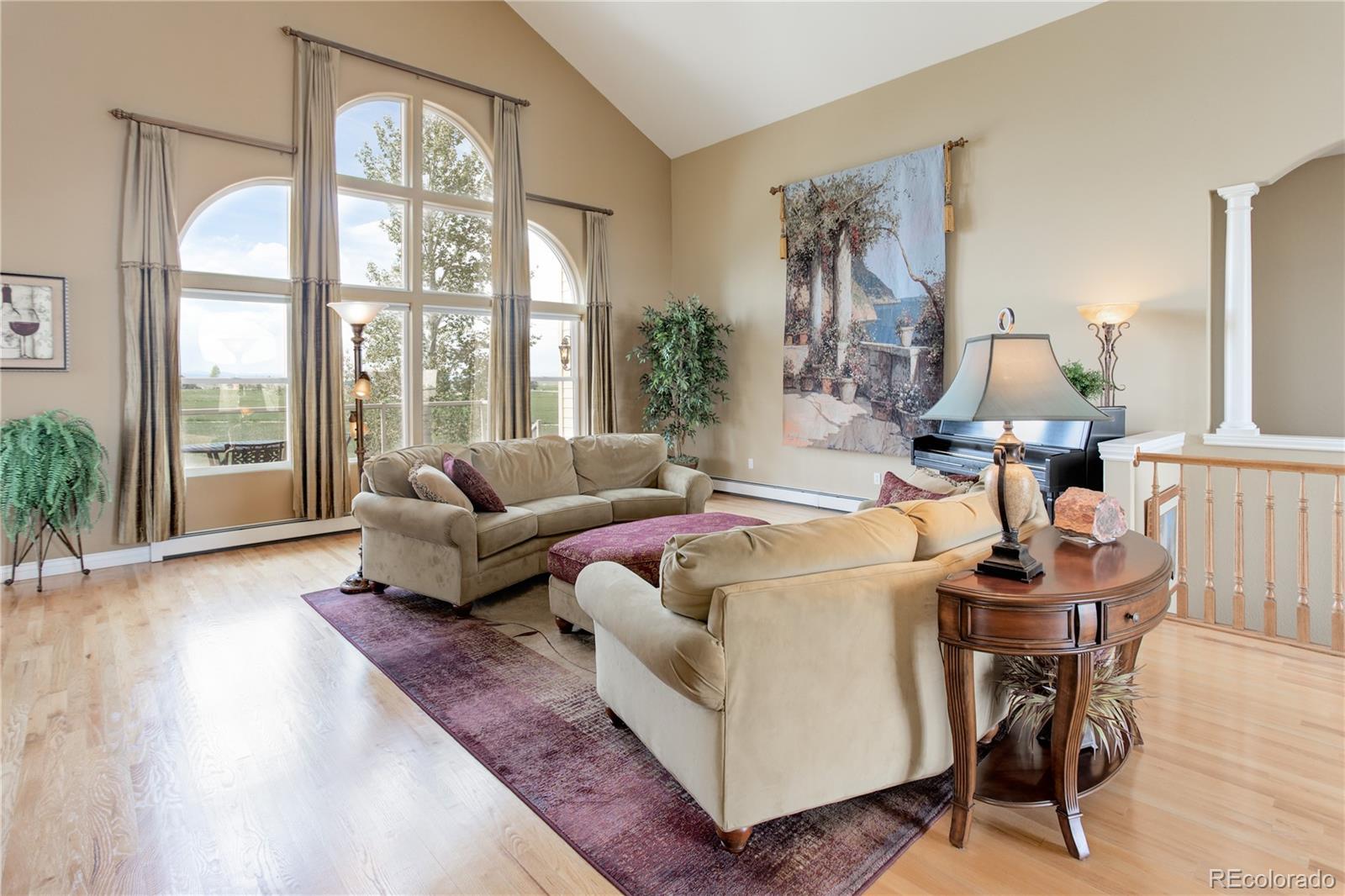 24943 Ben Kelly Road Elbert, CO 80106 - Photo 12 of 39 a living room with furniture and a large window