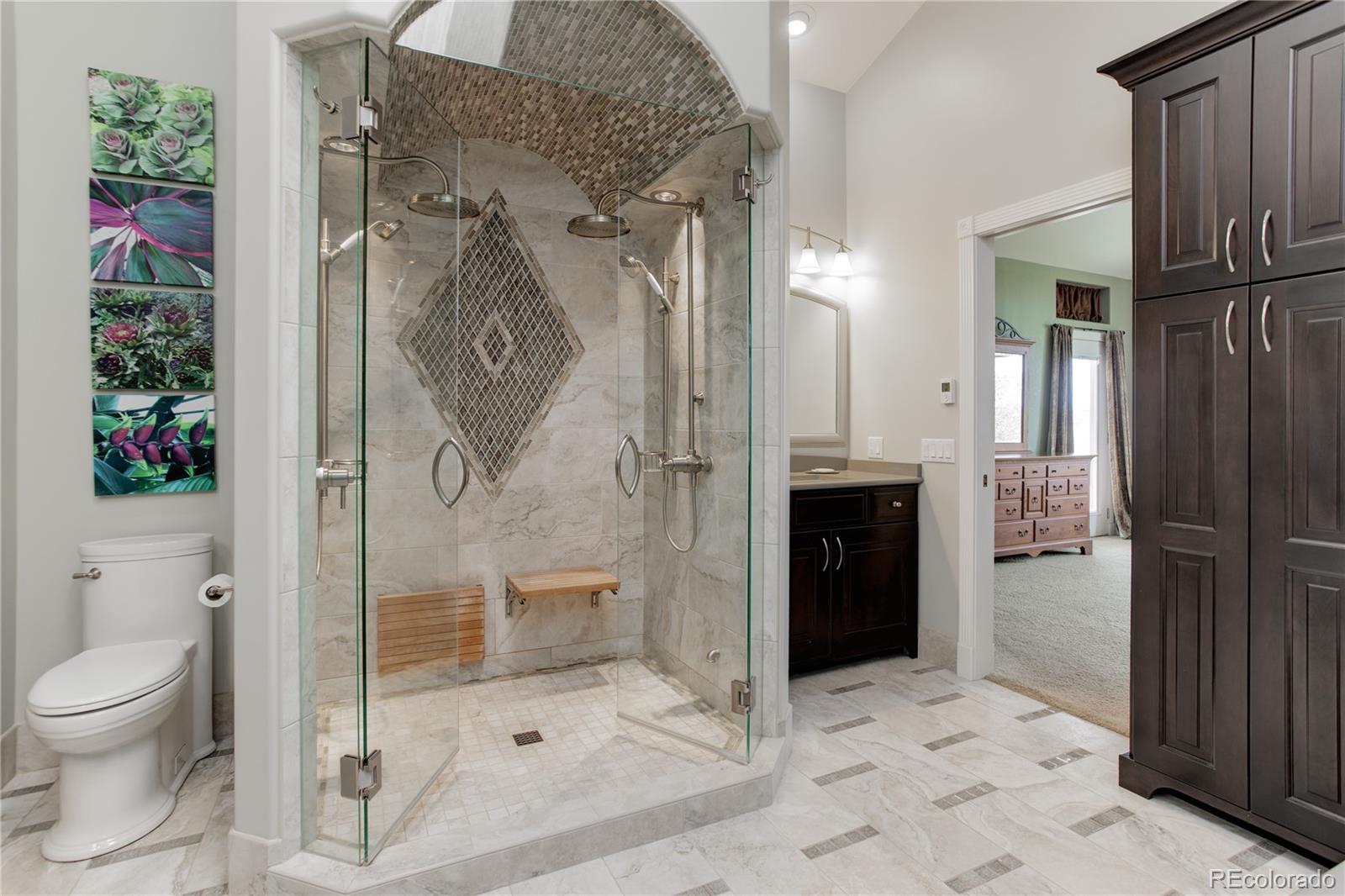 24943 Ben Kelly Road Elbert, CO 80106 - Photo 19 of 39 a bathroom with a shower and a toilet