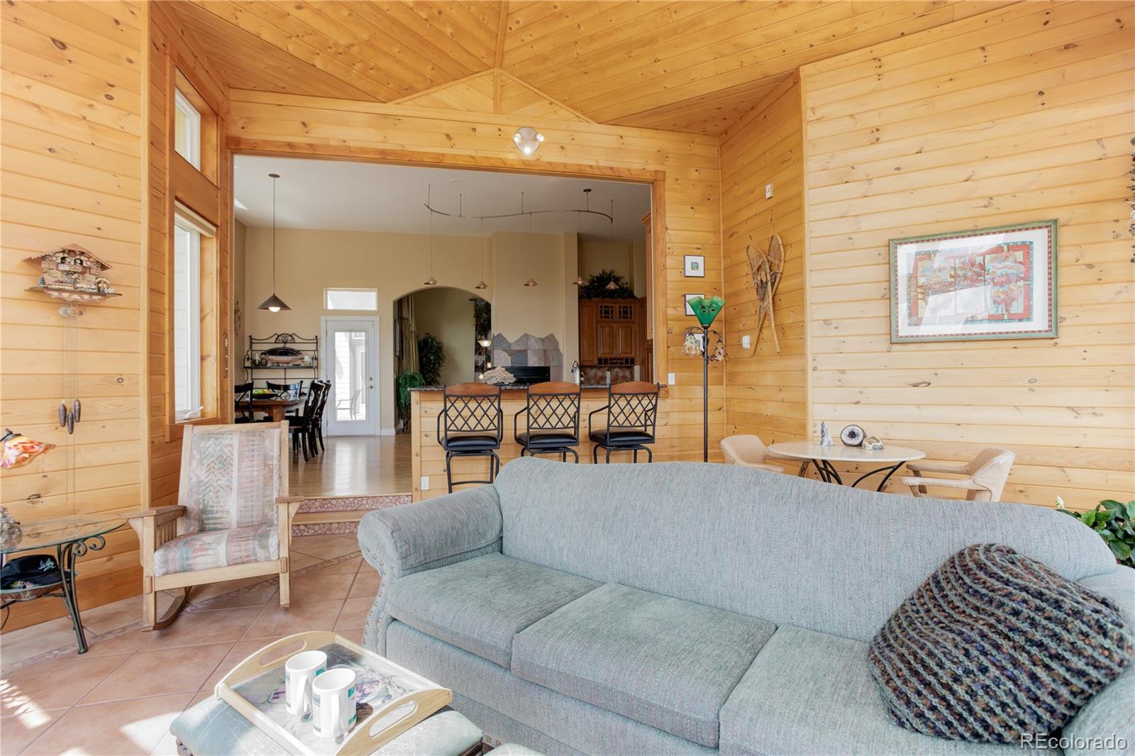 24943 Ben Kelly Road Elbert, CO 80106 - Photo 26 of 39 a living room with furniture and a large window