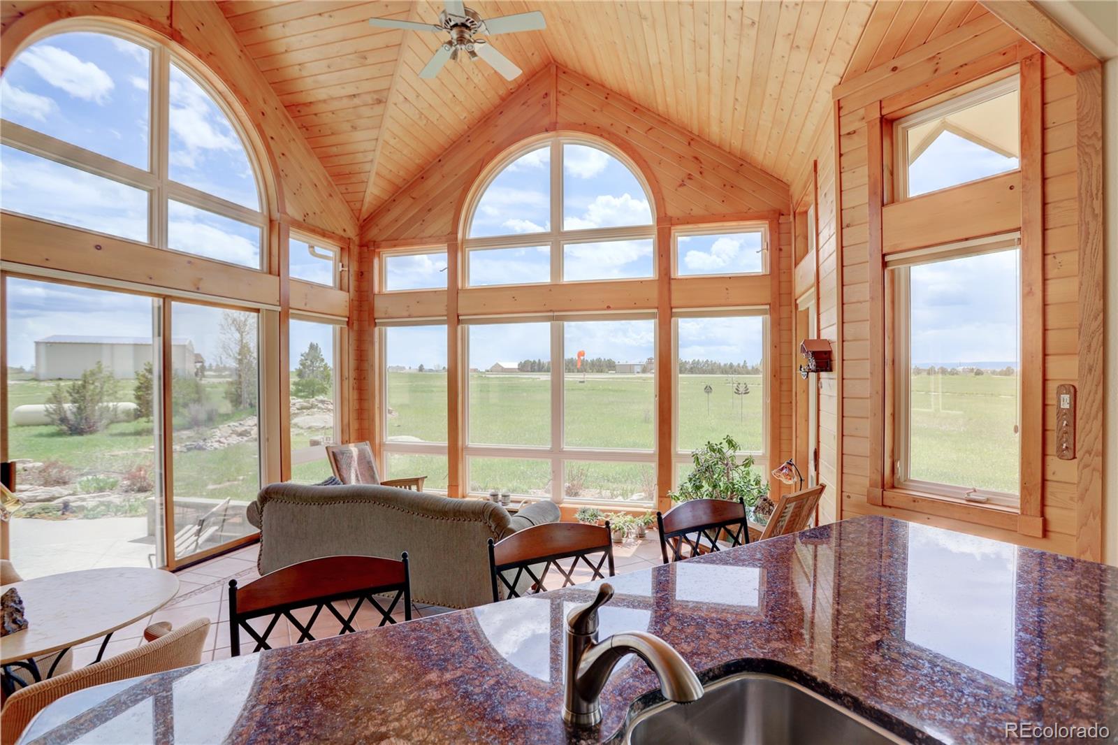 24943 Ben Kelly Road Elbert, CO 80106 - Photo 27 of 39 a view of a livingroom with furniture window and outside view