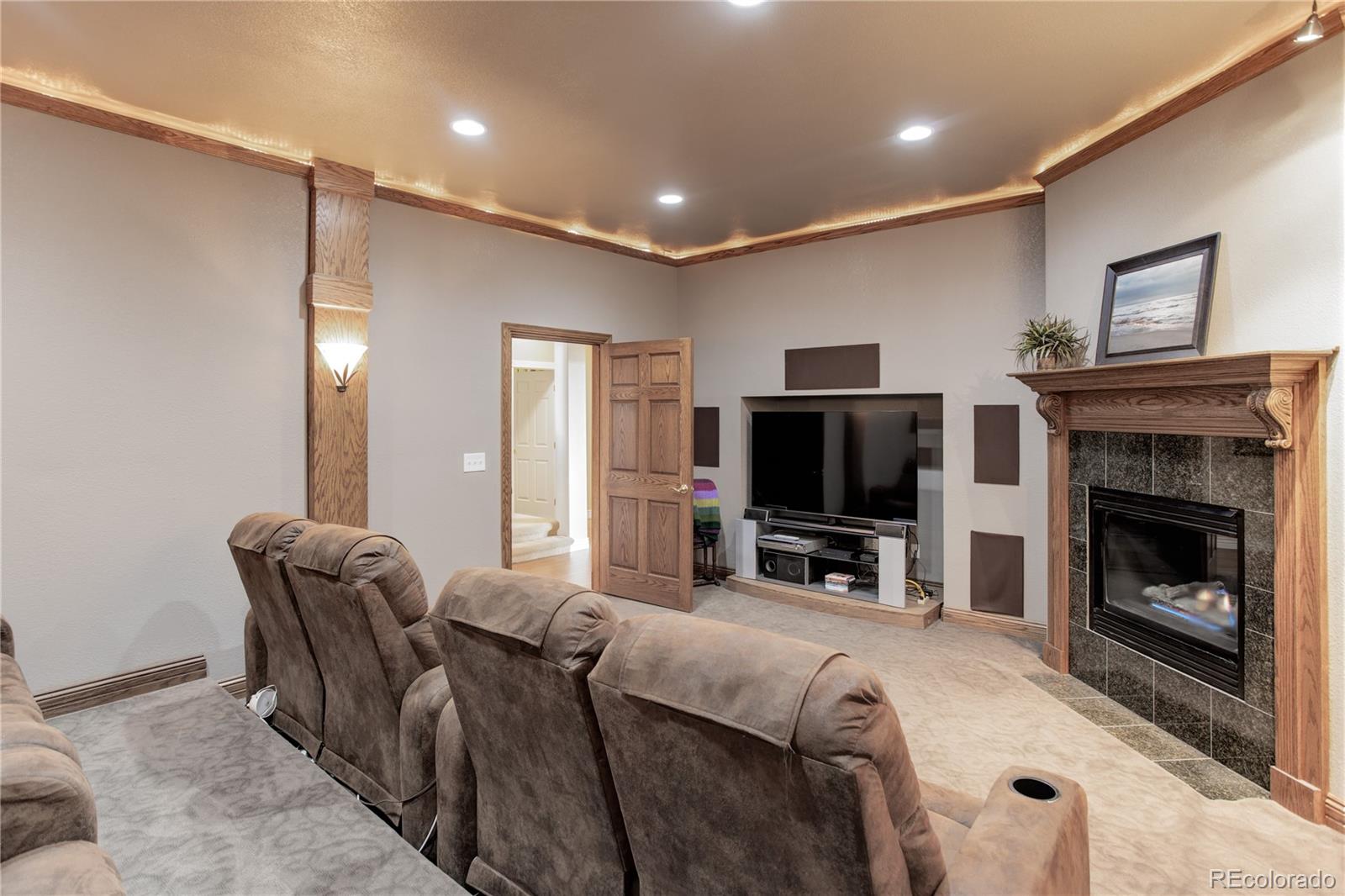 24943 Ben Kelly Road Elbert, CO 80106 - Photo 29 of 39 a living room with furniture and a flat screen tv
