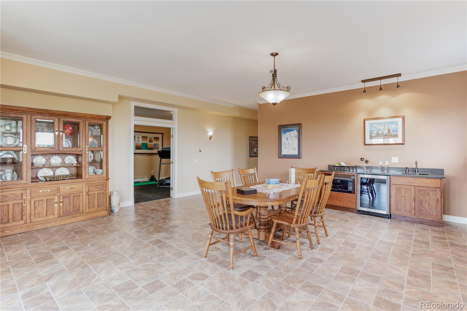 24943 Ben Kelly Road Elbert, CO 80106 - Photo 30 of 39 a view of a dining room with furniture and chandelier
