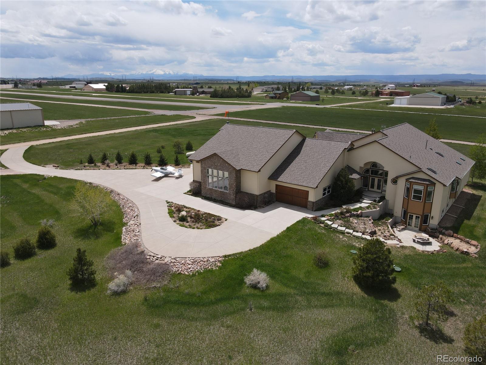 24943 Ben Kelly Road Elbert, CO 80106 - Photo 3 of 39 an aerial view of a house with a lake view