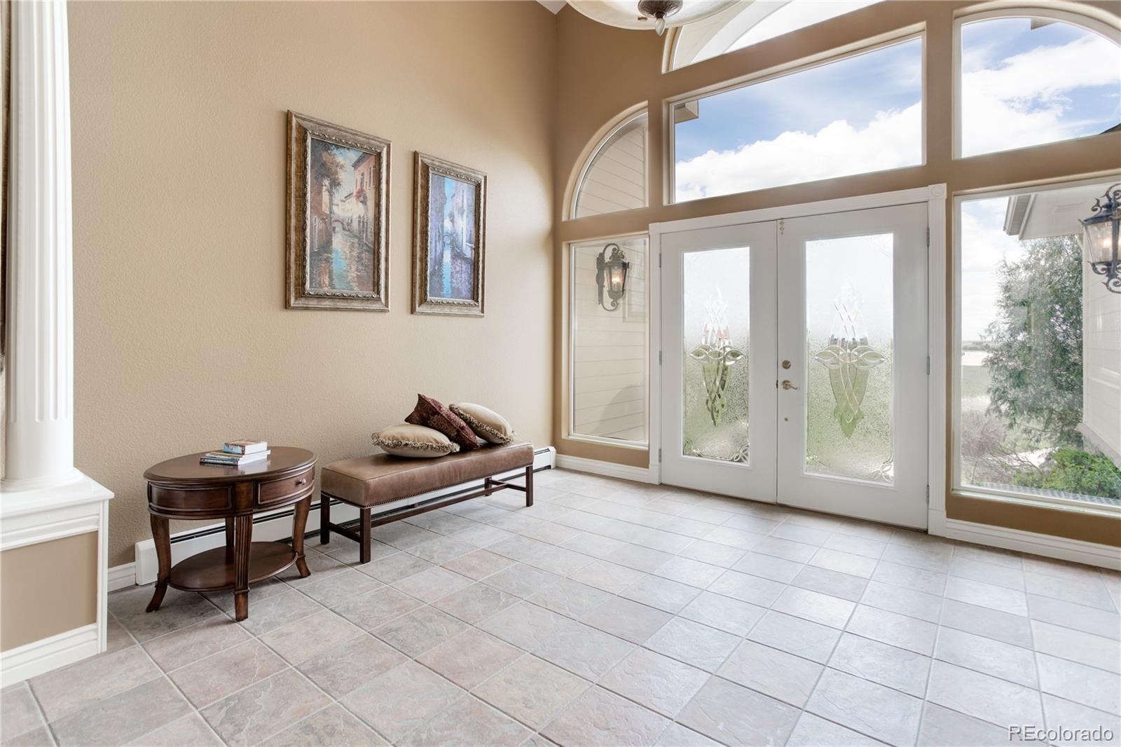24943 Ben Kelly Road Elbert, CO 80106 - Photo 10 of 39 a living room with furniture and a large window